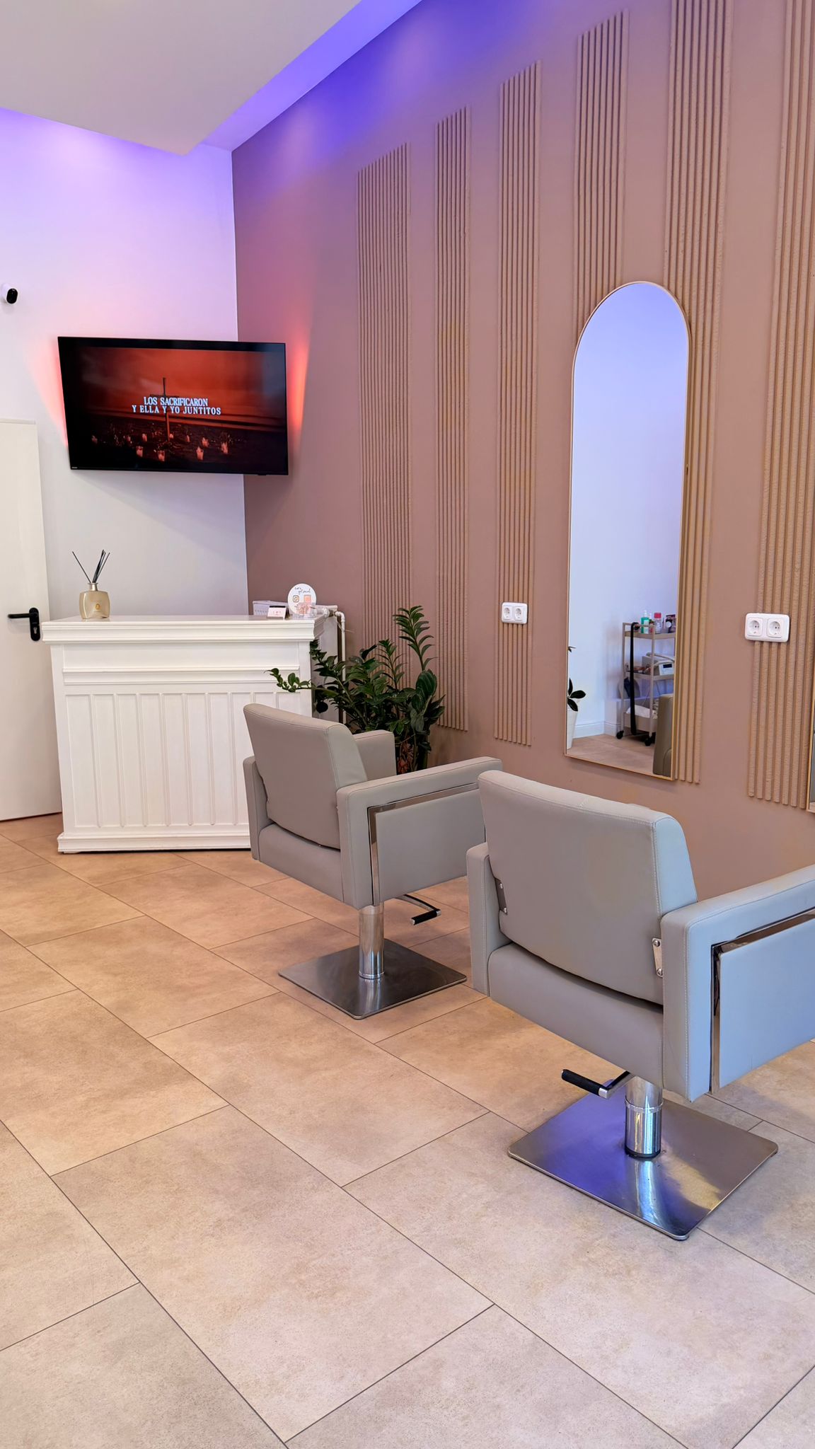 Salon styling chairs and mirrors inside Myzila Cosmetics